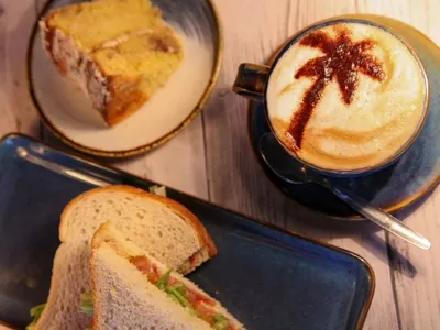 Cooffe, cake and a sandwich