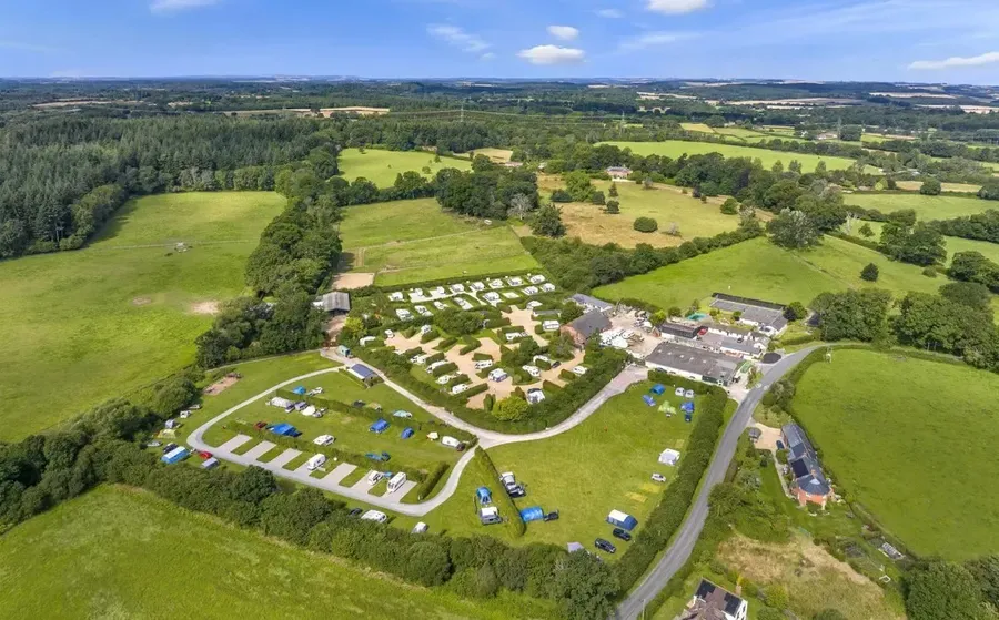 Pitches and countryside at Hill Cottage Farm Caravan & Camping Park
