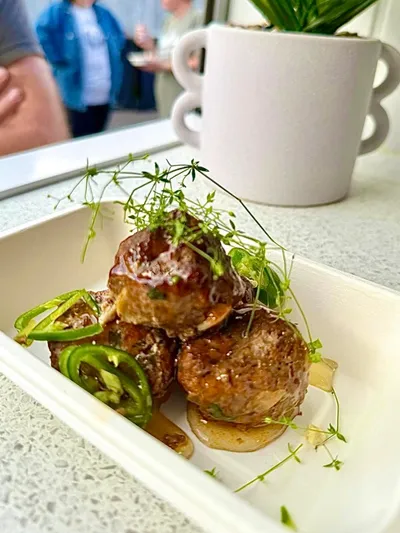 Meatballs in sauce served by T’s Tapas food van